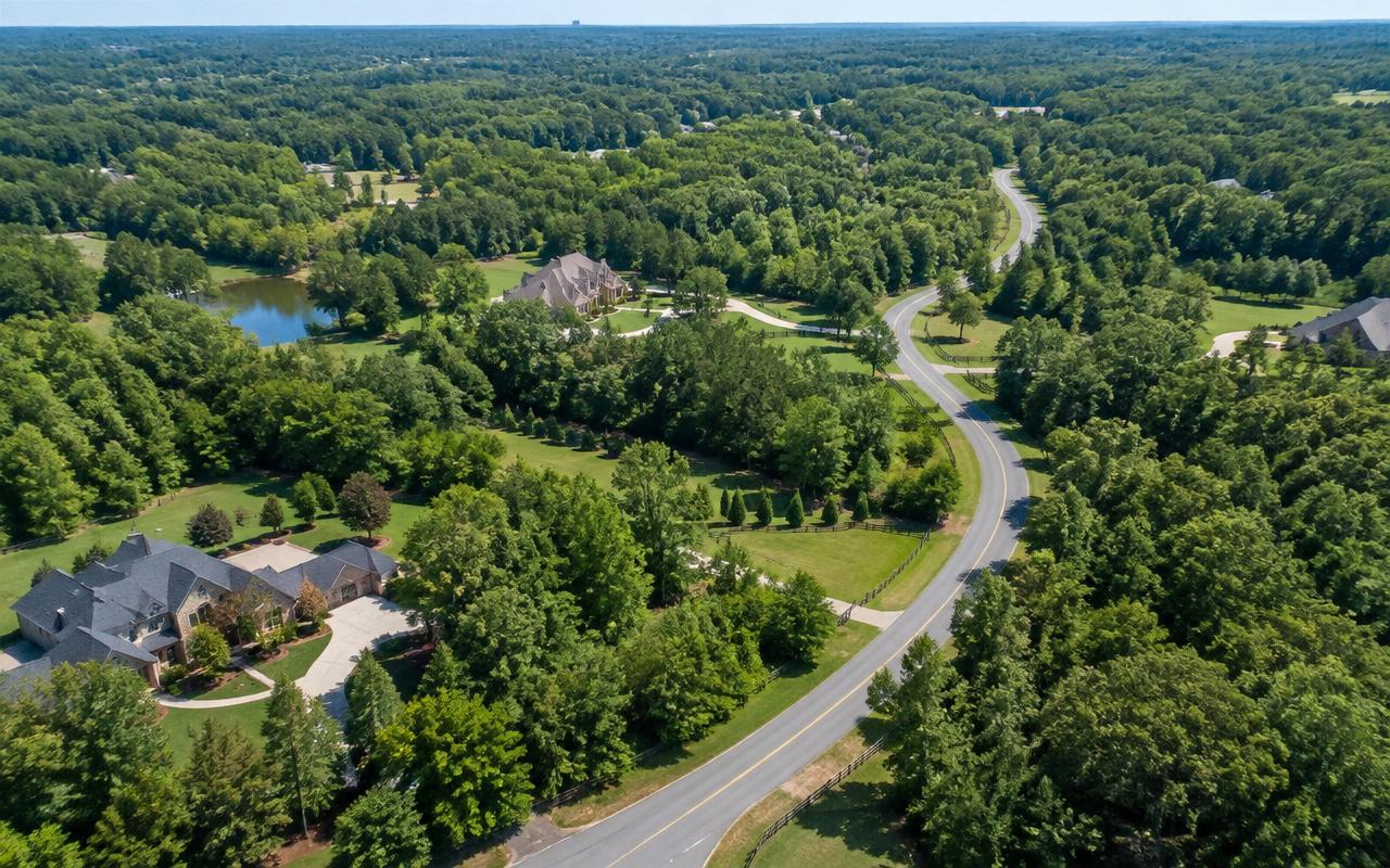 Aerial view of Weddington's wooded estate landscape